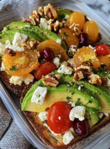 Avocado Toast with Feta, Cherry Tomatoes, Cranberries, and Walnuts