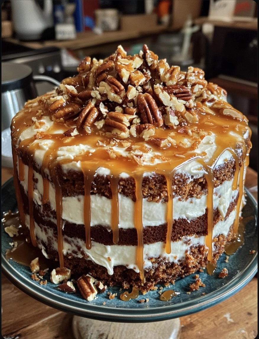Carrot Cake! Today I made a carrot cake, with caramel drizzle, apple sauce, cream cheese icing, toasted pecans and candied carrot twirls! All from scratch :)