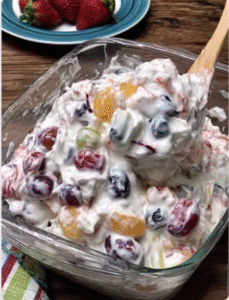 creamy fruit salad in a glass